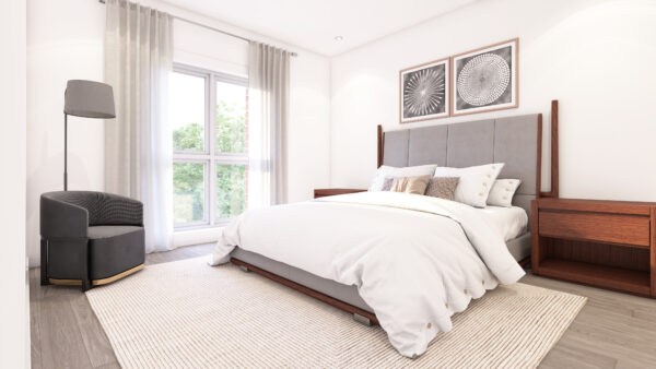 Chambre lumineuse dans un appartement à louer à Laval, avec grand lit, décoration moderne, et fenêtres offrant une vue sur l'extérieur. Parfait pour un logement confortable.