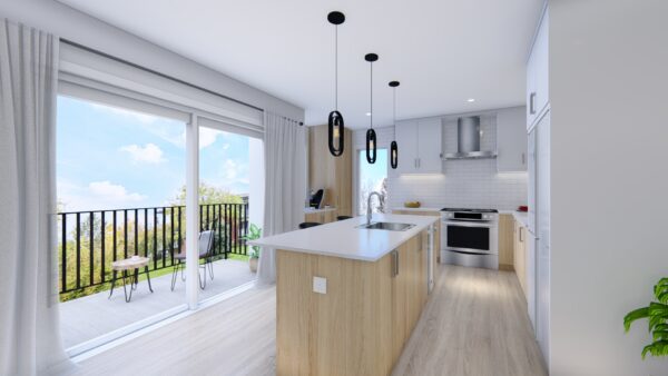 Vue intérieure d'un appartement moderne de 2 chambres à Saint-Donat-de-Montcalm, avec cuisine ouverte, îlot central, et accès à un balcon ensoleillé.